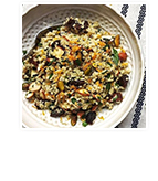 Seasonal quinoa salad with almonds, pistachios, apricots, dried cherries, and citrus